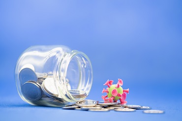 jar with coins and a coronavirus cell toy