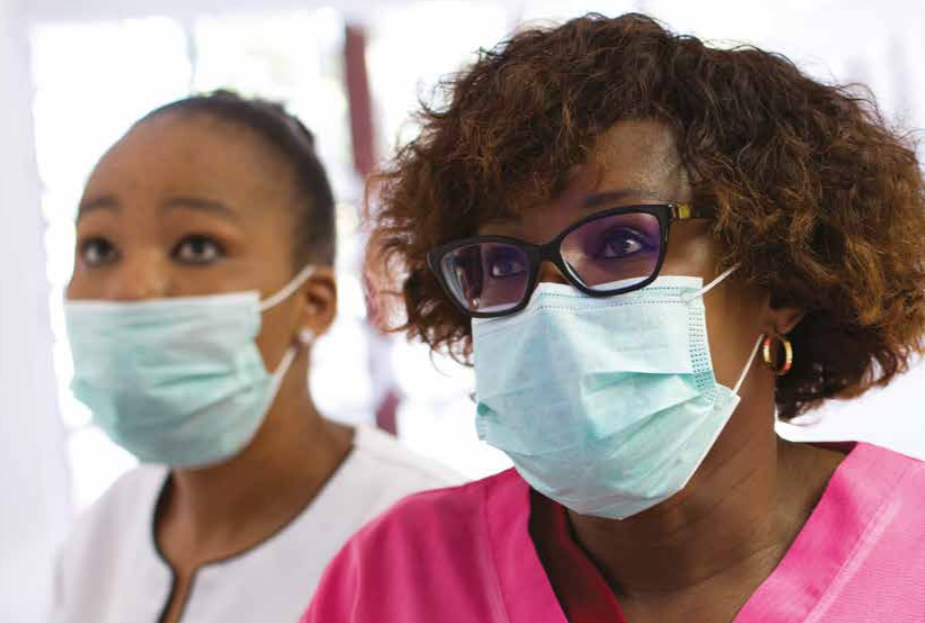 Close up of two African women with masks