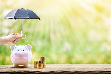 piggy bank with mask under umbrella