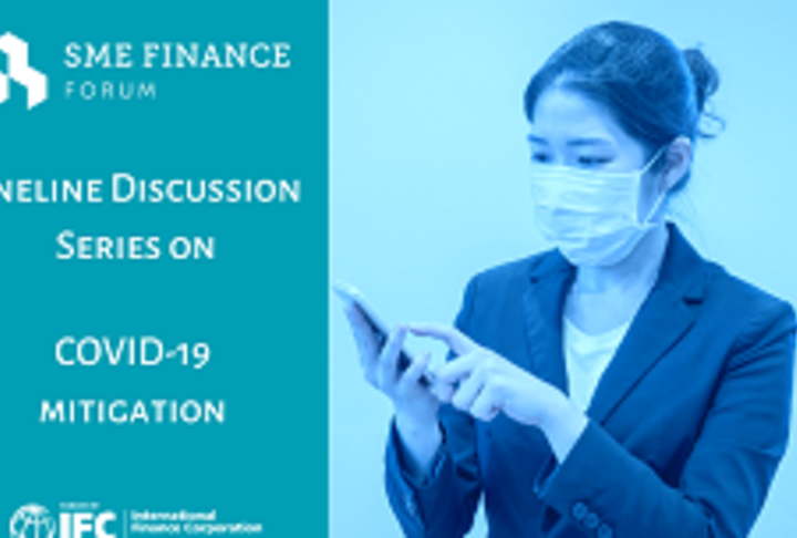 Executive woman with mask looking at mobile phone - Card
