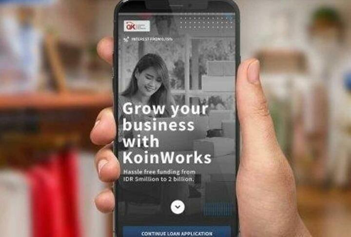A phone with KoinWorks's mobile app