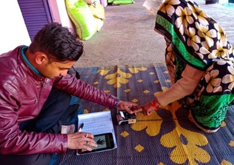 Person lending money to a woman in Asia