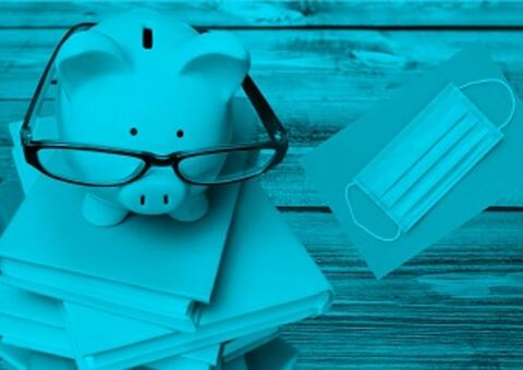 piggy bank with glasses on books and a mask on the side