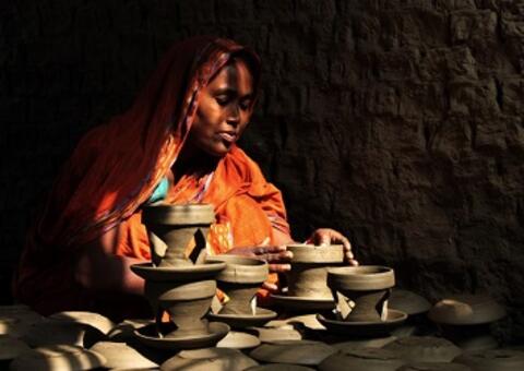 An entrepreneur in Bangladesh puts the finishing touches on her clay pots. Photo: Moksumul Haque, 2015 CGAP Photo Contest An entrepreneur in Bangladesh puts the finishing touches on her clay pots. Photo: Moksumul Haque, 2015 CGAP Photo Contest
